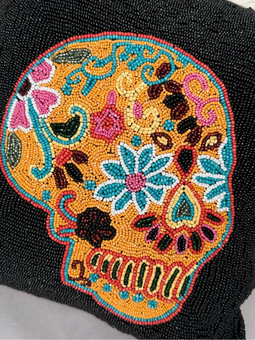 Black beaded 14” pillow with skull motif